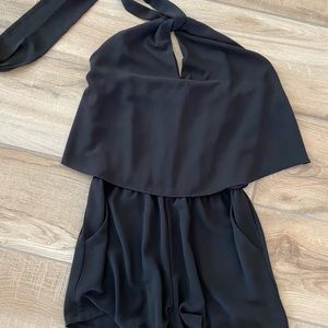 Halter tie romper with pockets.